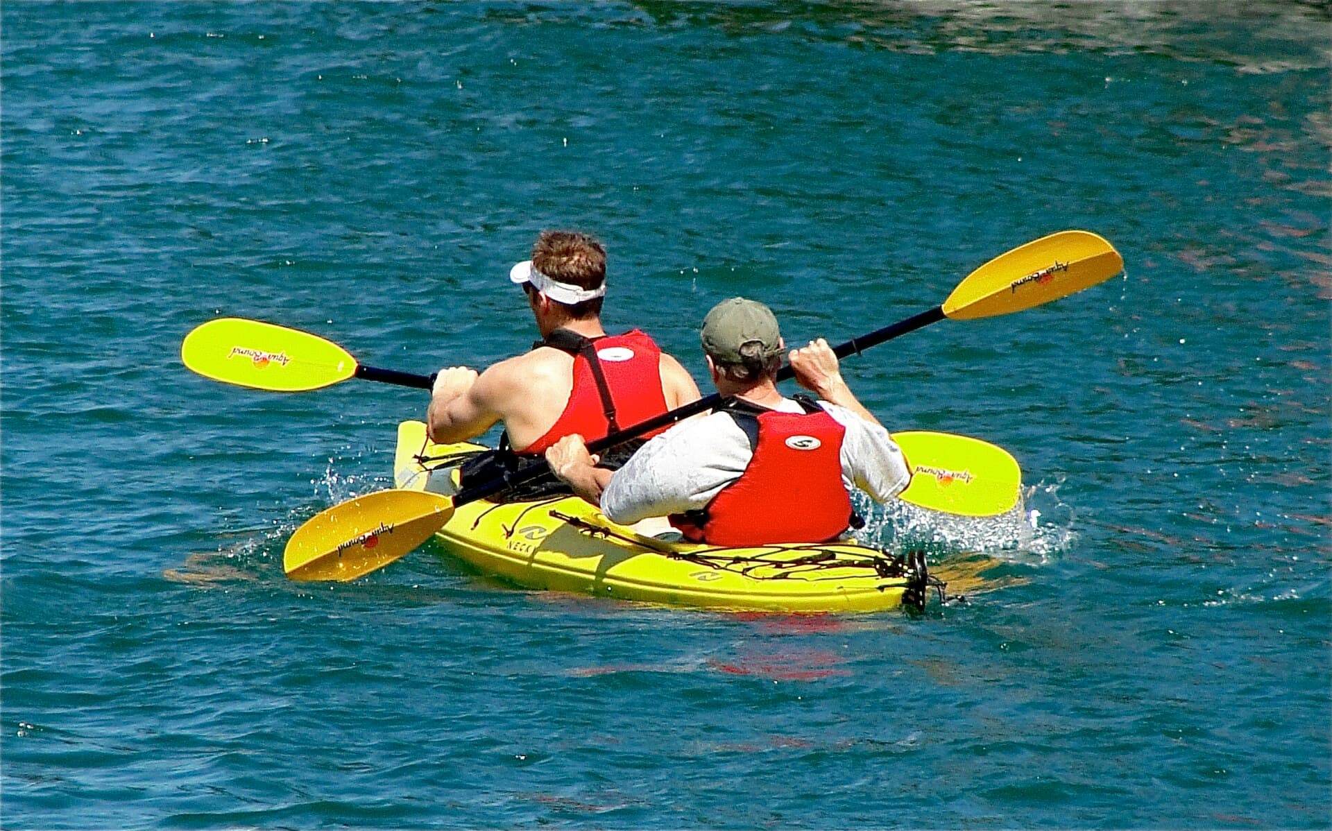 Kayakers paddling on a Michigan lake