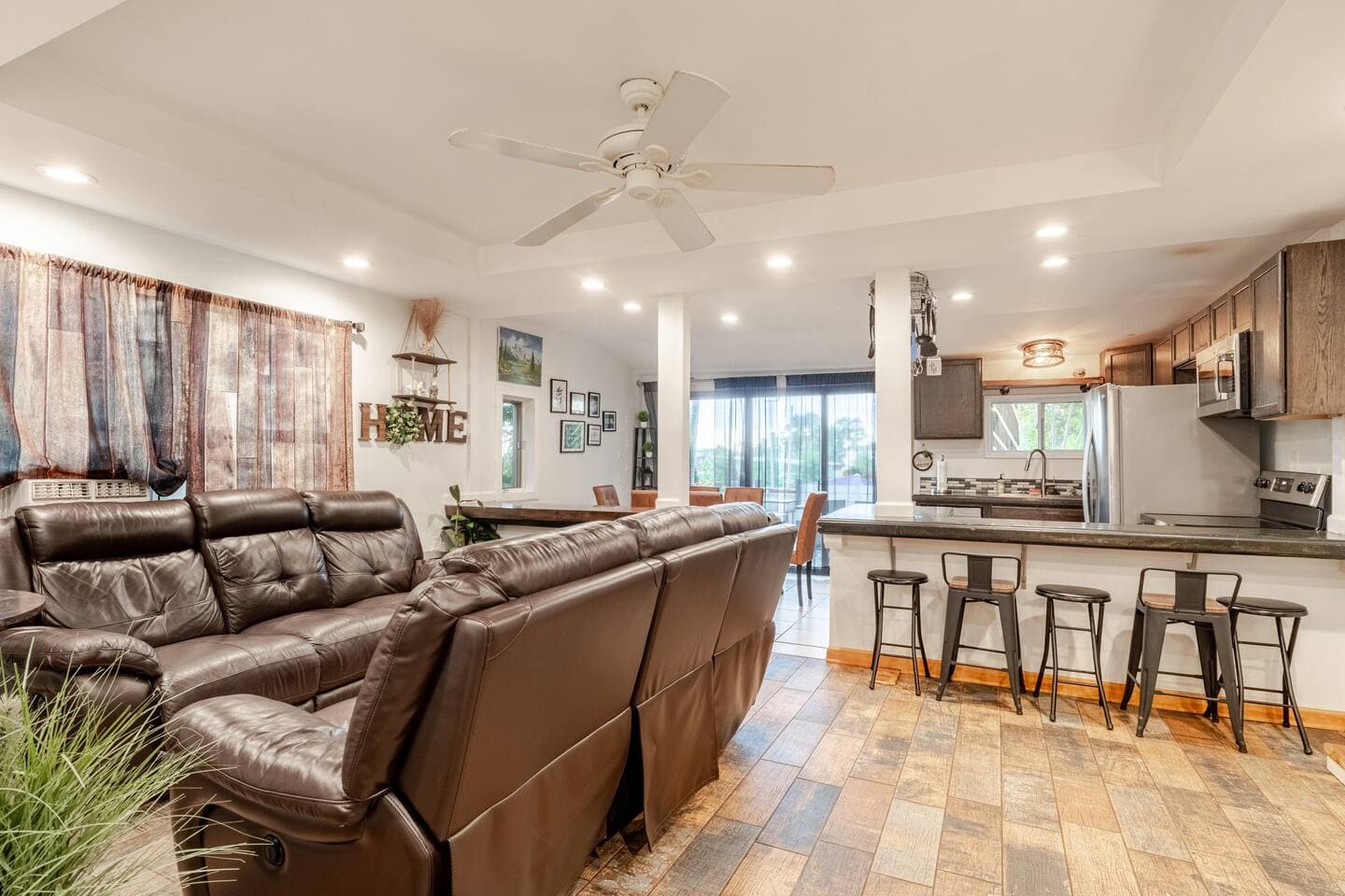 Open-concept living and kitchen with breakfast bar