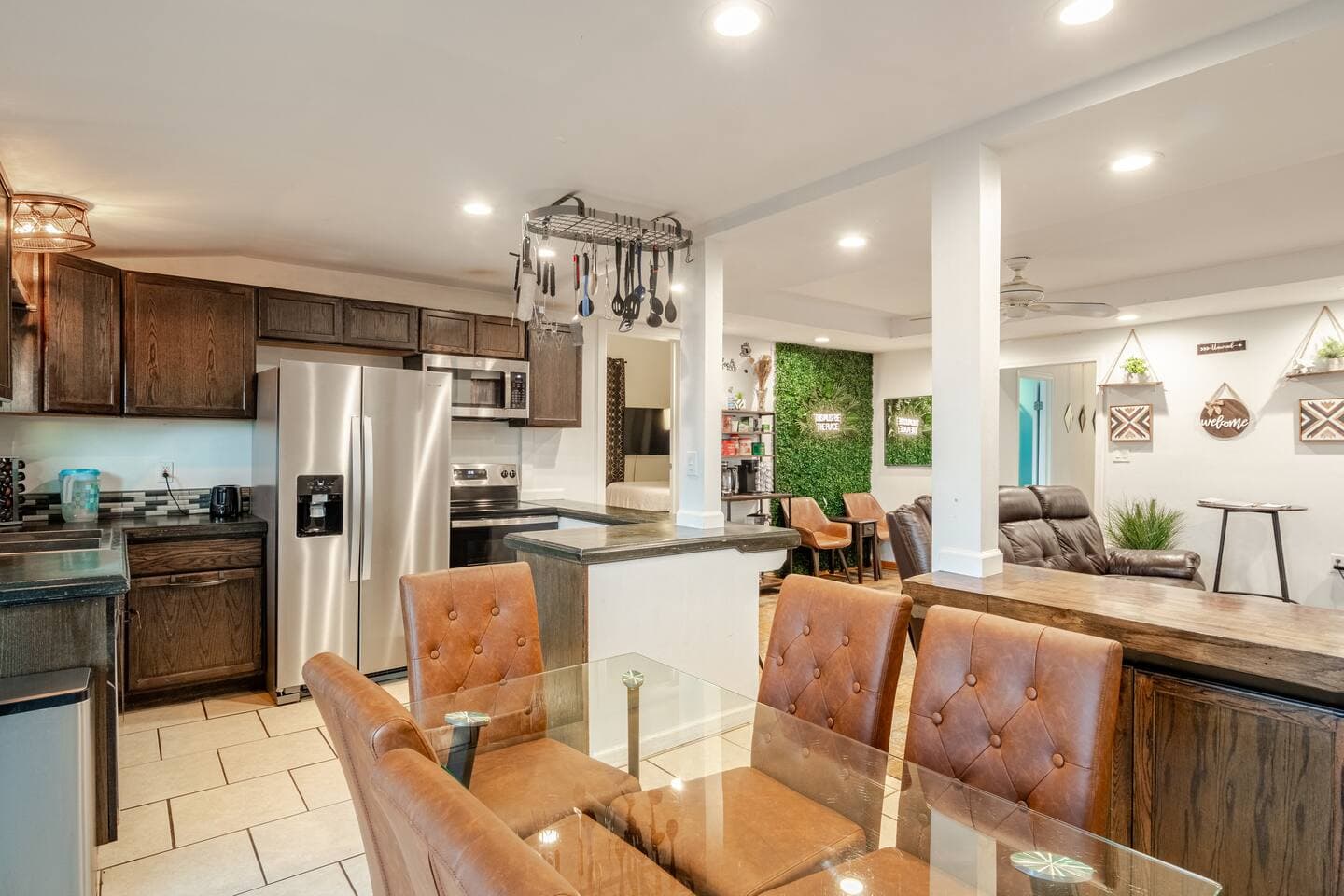 Kitchen with breakfast bar and moss accent wall