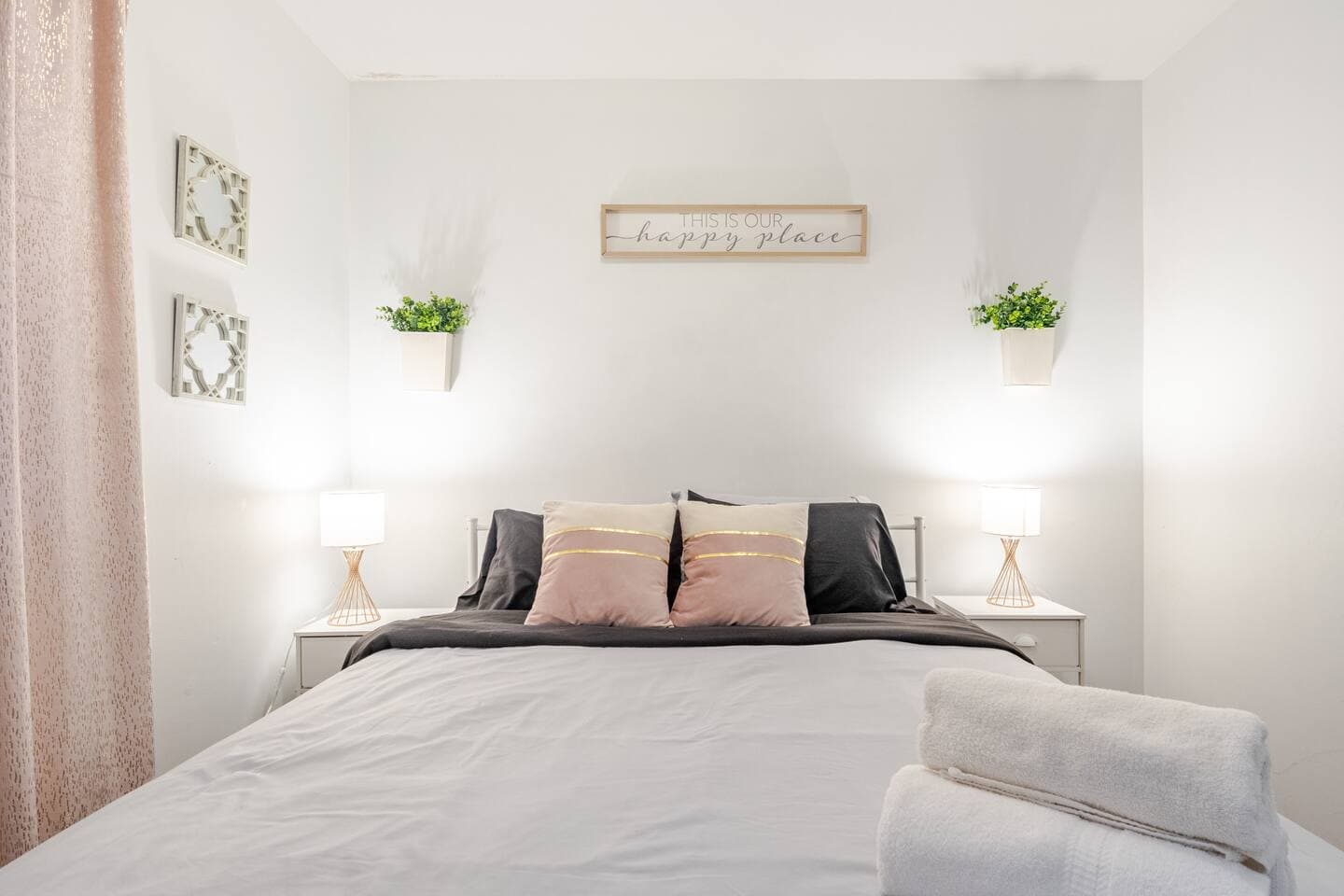 Bedroom 1 — queen with blush-pink accents