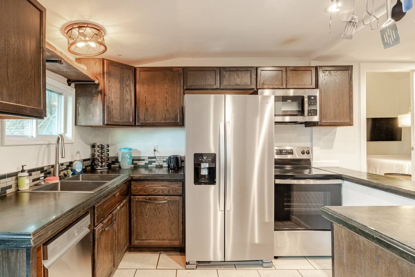 Full kitchen with side-by-side refrigerator