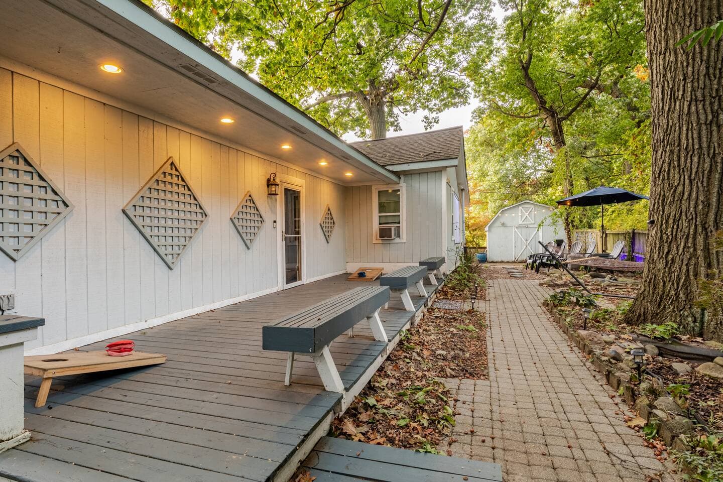 Covered side porch lined with benches