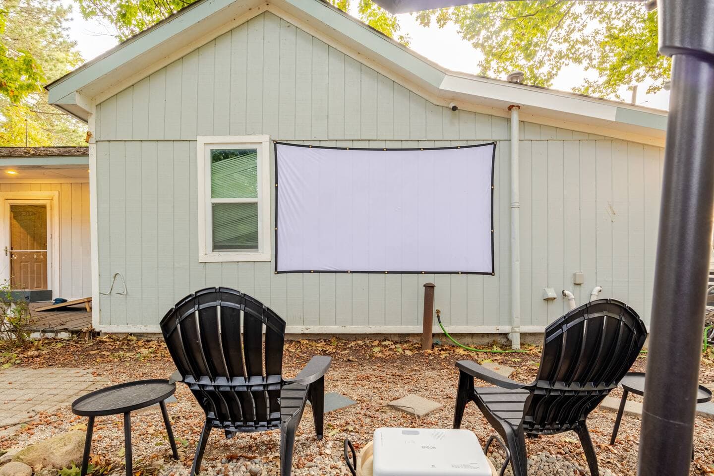 Projector screen set up on the back of the house