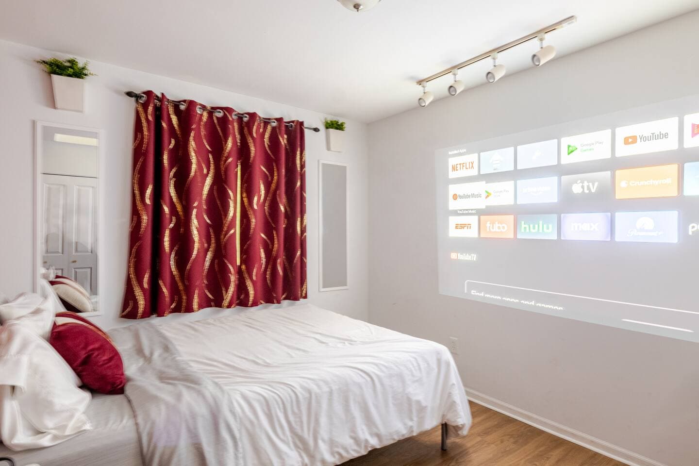 Bedroom 3 — queen with a wall projector for streaming