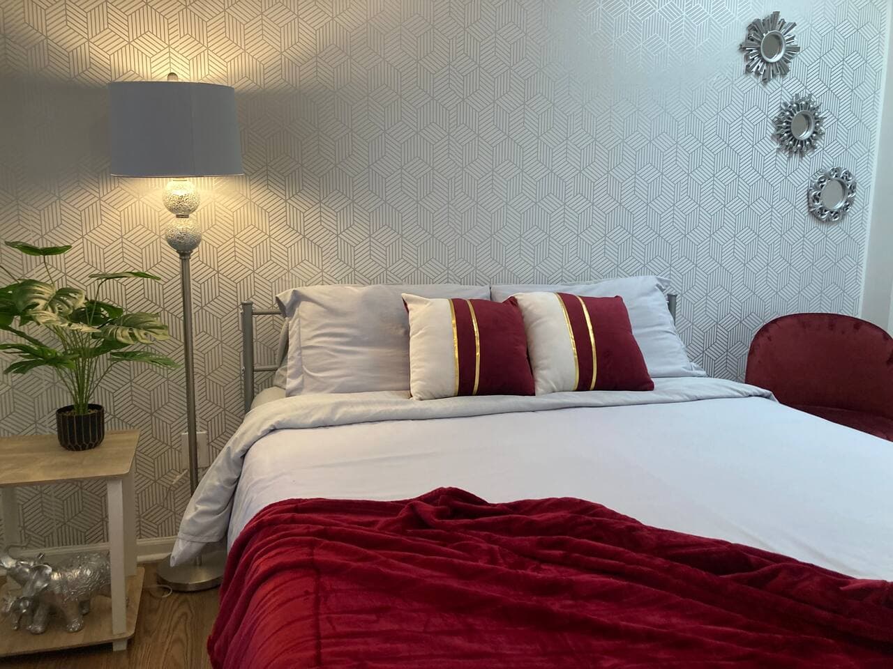 Bedroom 3 — red and gold accents