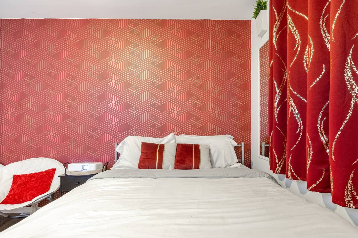 Bedroom 3 — bold red accent wall