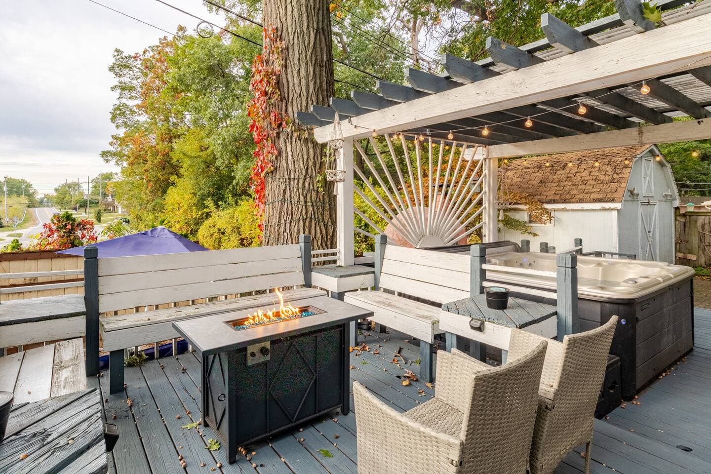 Deck with fire table, seating, and the hot tub