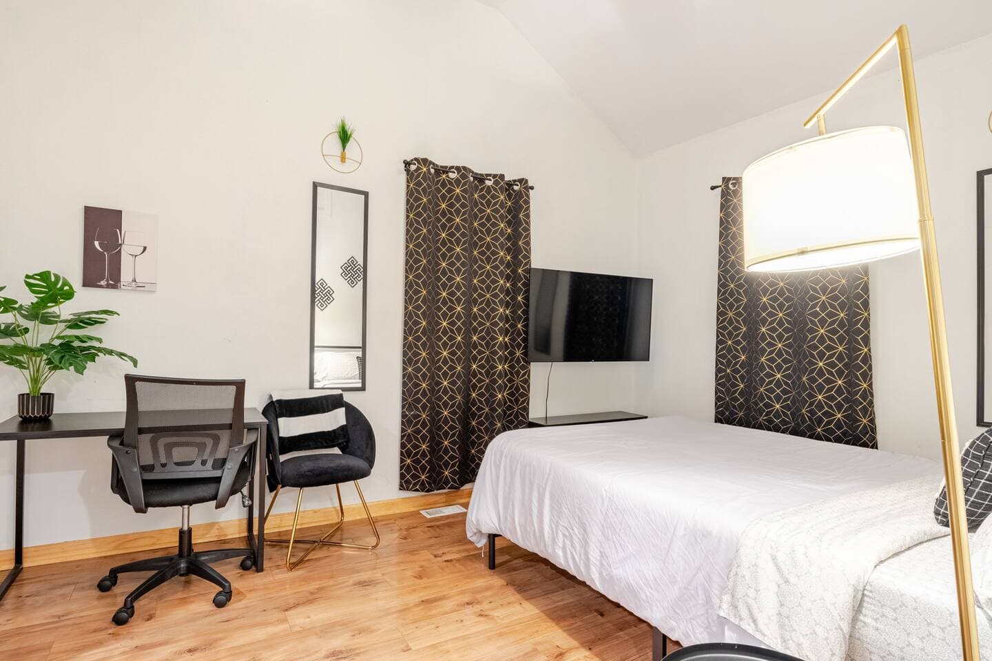 Bedroom 2 — black-and-gold room with a desk workspace