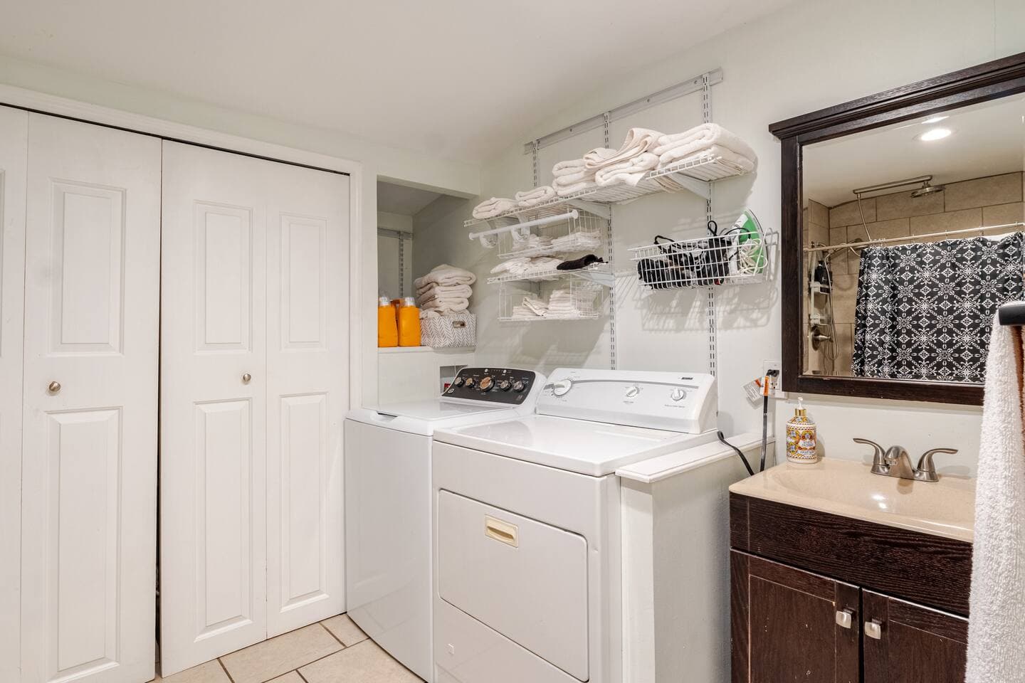 Laundry nook with washer, dryer, and fresh linens