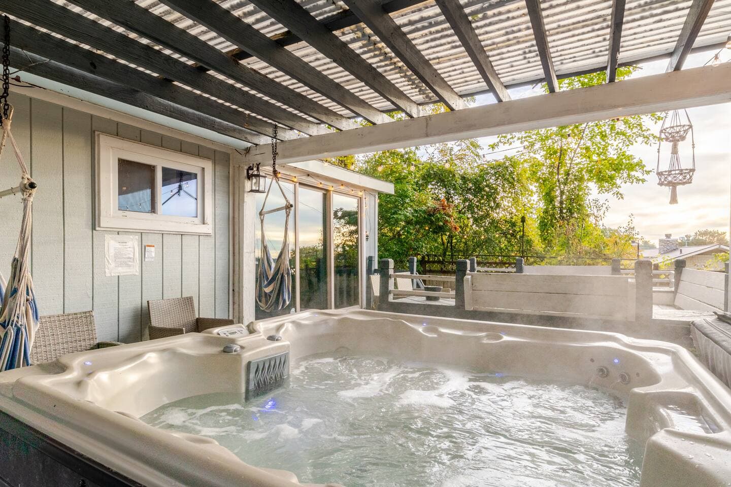 Hot tub under the pergola in evening light